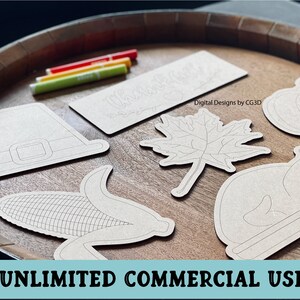 May include: A set of six Thanksgiving-themed craft cutouts, including a pilgrim hat, a cornucopia, a pumpkin, a turkey, a maple leaf, and a sign that says "Thankful".