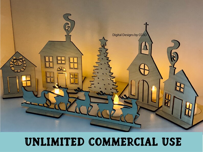 May include: A wooden Christmas village scene with a church, houses, a Christmas tree, and a sleigh with reindeer. The houses and church have windows and doors, and the tree is decorated with stars. The scene is lit with tea lights.