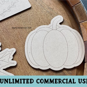 May include: A brown wooden craft blank shaped like a pumpkin with a stem. The blank is ready to be painted or decorated.  The blank is on a wooden surface.