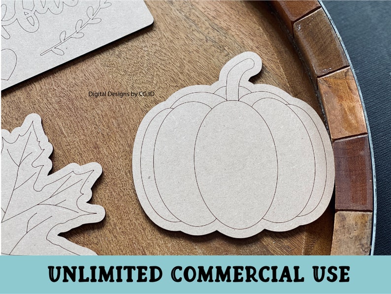 May include: A brown wooden craft blank shaped like a pumpkin with a stem. The blank is ready to be painted or decorated.  The blank is on a wooden surface.