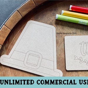 May include: A printable Thanksgiving craft design featuring a pilgrim hat and a "thank you" sign. The design is on a brown background and is ready to be colored in.