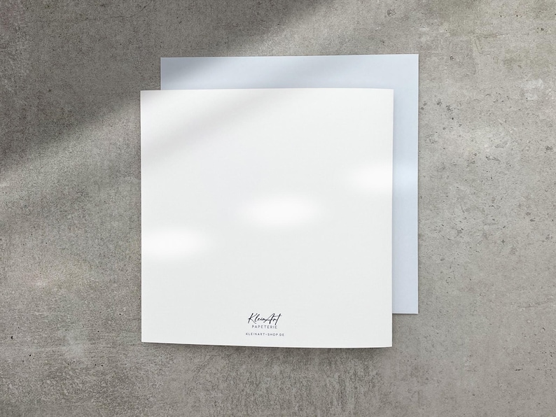 May include: Blank white card with a light gray envelope. The card has the text "Kleancut Paperie" and "Old Hart - 0000 00" printed on the bottom.