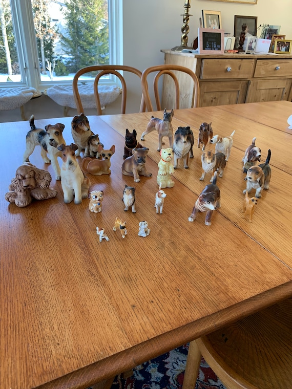 A collection of vintage dog figurines Etsy