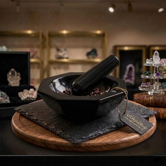 Carved from genuine black agate, this mortar and pestle is as much a sculptural object as a kitchen tool — the banding and depth of the stone make every piece one-of-a-kind.