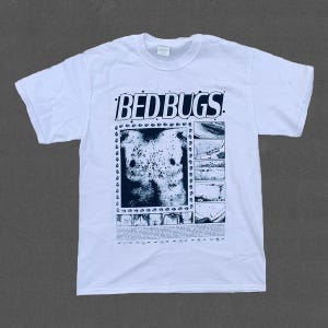 May include: White t-shirt with the text "BED BUGS" in a bold, stylized font. The shirt features a black and white graphic design of a torso and comic strip panels. The shirt is made of a soft, comfortable material.
