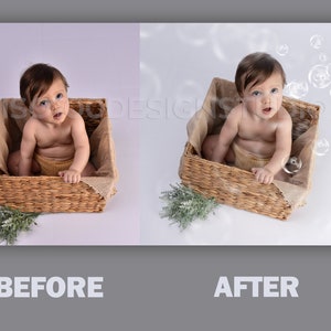 May include: A baby sitting in a wicker basket with a burlap lining. The baby is looking up and there are bubbles floating in the air around the baby.