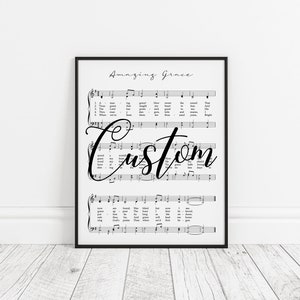 May include: Black and white printable art print of the hymn "Amazing Grace" with the word "Custom" written in cursive over the sheet music.