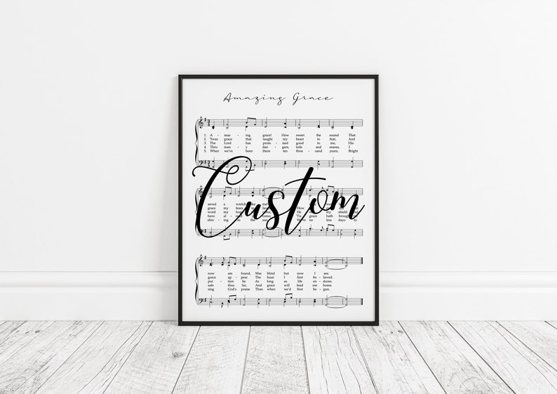 May include: Black and white printable art print of the hymn "Amazing Grace" with the word "Custom" written in cursive over the sheet music.