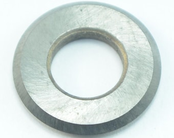 May include: A silver metal ring with a beveled edge and a smooth, slightly textured surface.