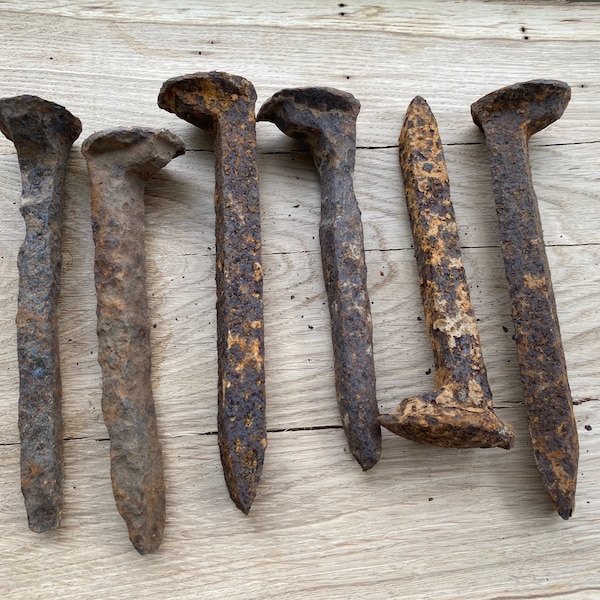 Rusty vintage railroad spike nails. Handmade, hand-forged, steel nails. Art project. Salvaged nails. Restoration art. Antique nails. Rustic.