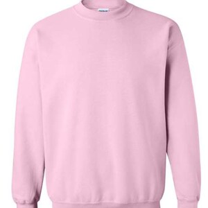 May include: A plain pink sweatshirt with long sleeves and a crew neck.