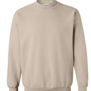 May include: A plain, light beige sweatshirt with a crew neck and long sleeves.