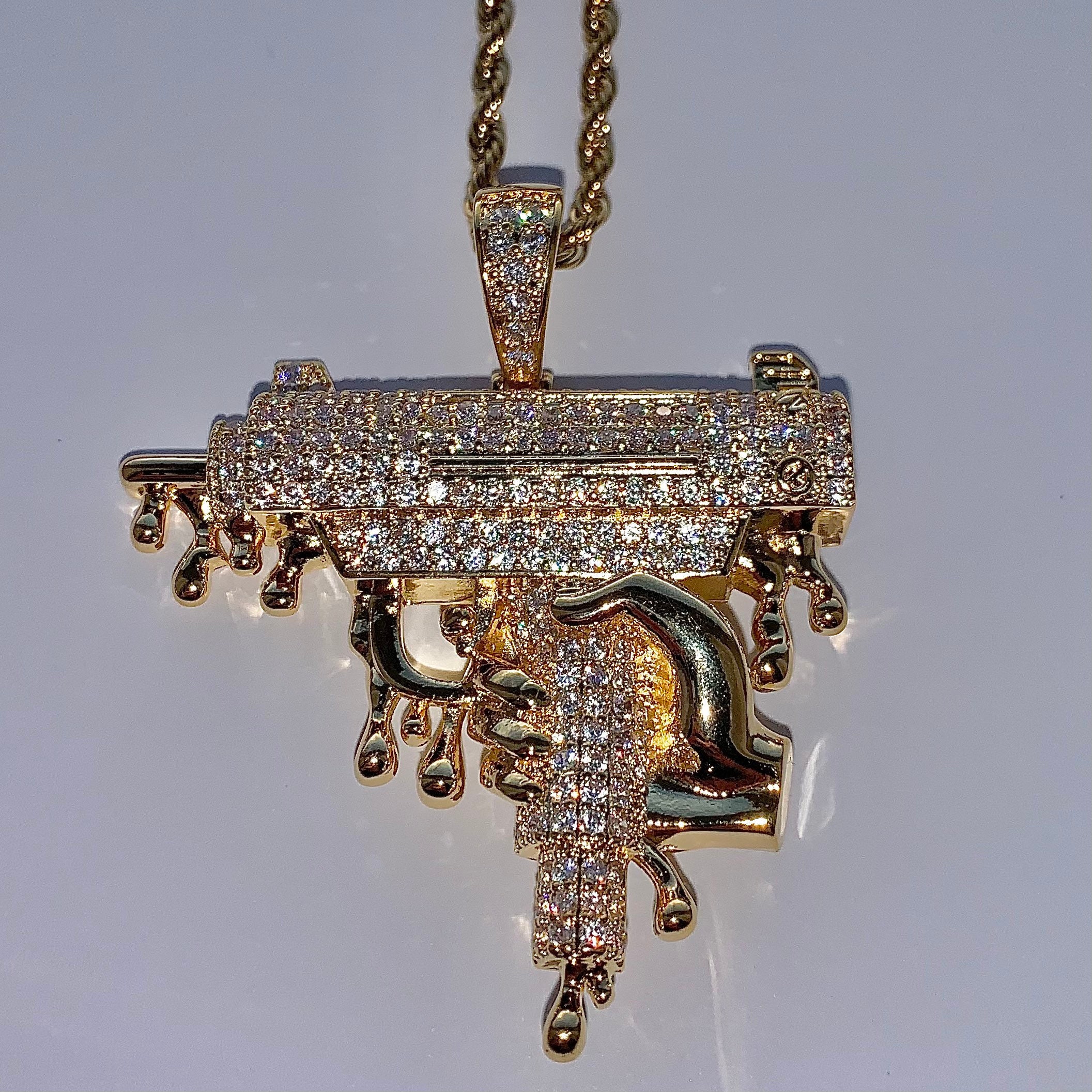 Uzi Hand Holding Dripping Gun Bling CZ Cubic Zirconia Gold