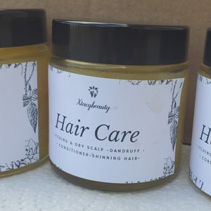 May include: Three amber glass jars with black lids labelled "Xincybeauty Hair Care" with the text "Itching & Dry Scalp - Dandruff - Conditioner - Shinning Hair."