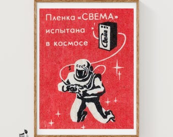 Lámina artística de un cosmonauta con cámara en una caja de cerillas, propaganda rusa vintage (decoración espacial).