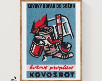 May include: A framed vintage-style poster on a blue background featuring a graphic illustration of metal scrap items including a can and a chair. The text reads KOVOVÝ ODPAD DO SBĚRU, hotové proplácí, and KOVOŠROT in black and red lettering.