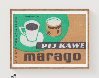 May include: A rectangular print featuring a green circle on a tan background. It displays a white coffee cup on a saucer, a cylindrical container labeled marago, and the text PIJ KAWĘ and marago. The left side includes vertical text 62 ZPZ SIANÓW PRZEC. 6 gr ZAP 25 GR.