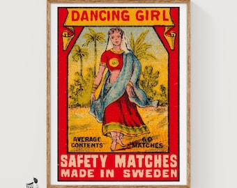 May include: A rectangular print featuring a vintage matchbox label design with the text DANCING GIRL, AVERAGE CONTENTS 60, SAFETY MATCHES, and MADE IN SWEDEN. The illustration depicts a figure in a red and blue garment against a yellow background.