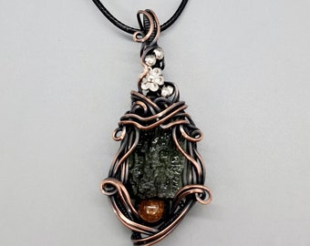 Moldavite and garnet wire wrapped pendant