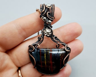 Iron tiger wire wrapped crystal pendant