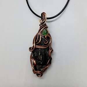 Moldavite and green garnet wire wrapped pendant