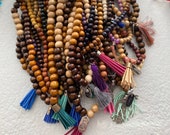 wooden prayer beads with charm