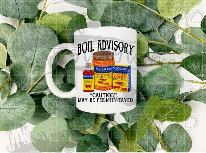 May include: White ceramic mug with a black and white graphic that says "BOIL ADVISORY" with a red crab and yellow and blue seafood boil cans. The text below the cans says "*CAUTION* MAY BE PEE-MON-TAYED"