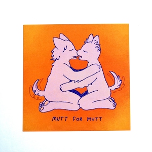 May include: Square sticker with an orange background featuring two light purple cartoon dogs embracing and kissing. The text "MUTT FOR MUTT" is printed in black at the bottom of the sticker.
