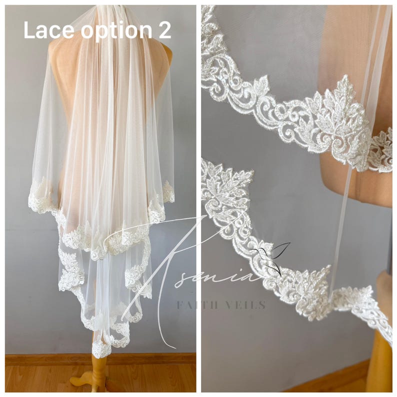 May include: A sheer, ivory-colored bridal veil with delicate lace trim. The veil is displayed on a mannequin, showcasing the intricate floral and scrollwork patterns of the lace. The text "Lace option 2" is visible.