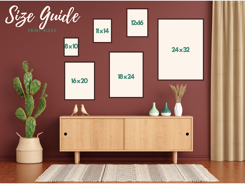 May include: A size guide for print sizes is displayed on a maroon wall. The guide shows framed prints in various sizes, including 8x10, 11x14, 12x16, 16x20, 18x24, and 24x32 inches. A cactus in a woven basket and a wooden cabinet with decor are also visible.