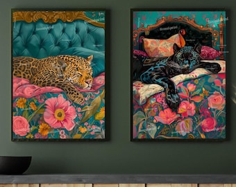 May include: Two framed art prints featuring big cats. One print shows a leopard resting on a bed with a teal headboard and floral bedding. The other print depicts a black panther on a bed with a similar floral design.