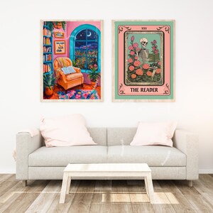 May include: Two framed prints, one with a pink background and a window with a moon and stars, and the other with a green background and a skeleton reading a book in a field of flowers. The text on the prints reads "Late Night Book Club" and "The Reader".