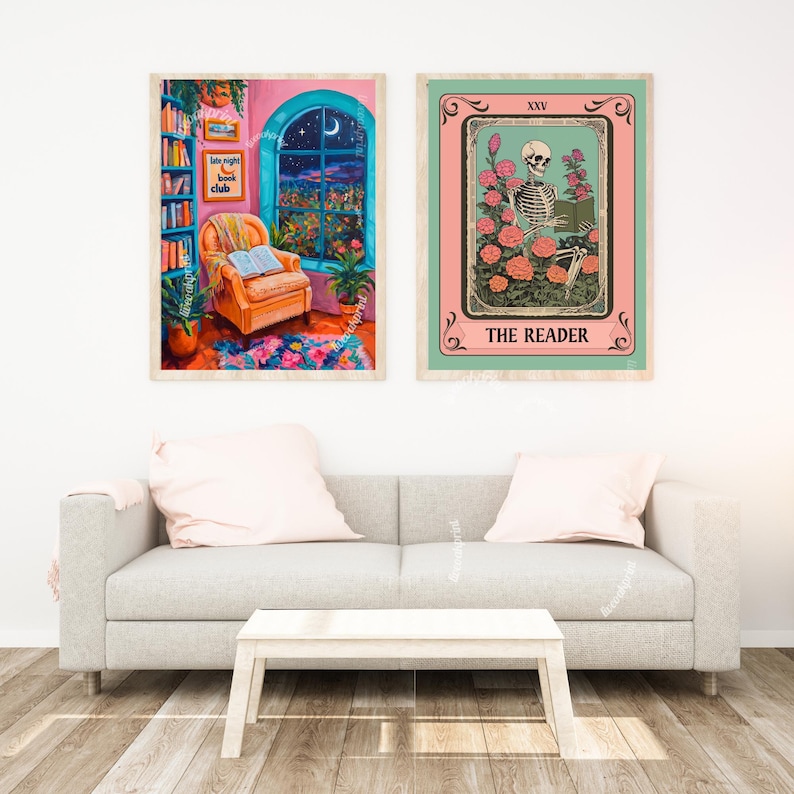 May include: Two framed prints, one with a pink background and a window with a moon and stars, and the other with a green background and a skeleton reading a book in a field of flowers. The text on the prints reads "Late Night Book Club" and "The Reader".