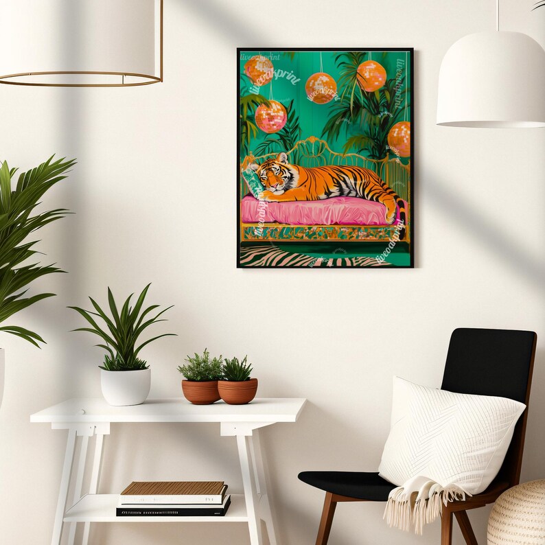 May include: A tiger is lying on a pink and gold chaise longue with a green background. The tiger is surrounded by disco balls and palm trees. The image is framed in black.