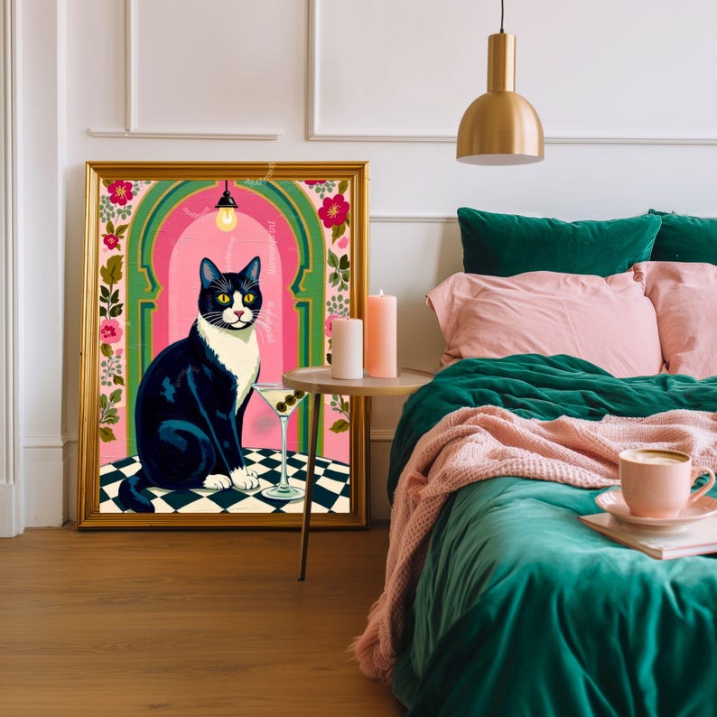 May include: A framed art print featuring a black and white cat sitting on a checkered floor, with a martini glass. The artwork has a gold frame and is set against a pink and green backdrop. The room has a bed with green and pink bedding.