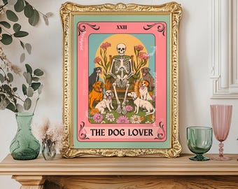 May include: A framed print featuring a skeleton seated on a throne, surrounded by dogs. The artwork has a pink and green color scheme with the text "THE DOG LOVER" at the bottom. The frame is gold.