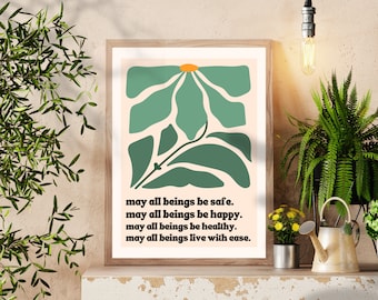 Puede incluir: Una impresión enmarcada con un diseño floral abstracto en verde y naranja. La impresión incluye el texto "may all beings be safe. may all beings be happy. may all beings be healthy. may all beings live with ease."