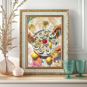 May include: A framed print shows a colourful still life of oysters on a platter with lemon wedges, cocktail sauce, and glasses of white wine. The artwork has a gold frame and is displayed on a wooden surface.