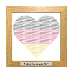 May include: A framed cross-stitch pattern of a heart shaped German flag in black, red, and yellow. The frame is light wood and the text "Instant Download PDF" is at the bottom.