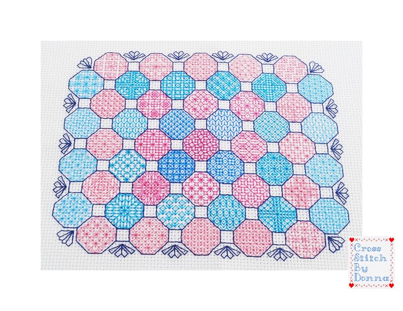 May include: A cross stitch pattern featuring a geometric design with octagons in shades of pink and blue. The pattern is surrounded by a border of blue and white.