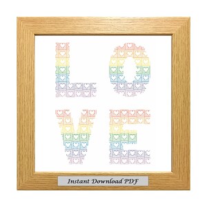 May include: A framed cross-stitch pattern of the word "LOVE" in rainbow colors. The letters are made up of small hearts and squares. The frame is light brown wood. The text "Instant Download PDF" is at the bottom of the image.