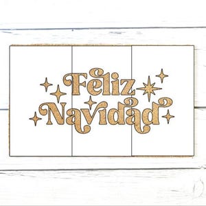 May include: A rectangular doormat featuring a white surface with the text Feliz Navidad in a glittery gold, retro-style font. The design is accented by several four-pointed star shapes in the same gold glitter finish, arranged around the lettering.