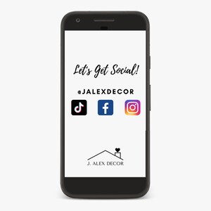May include: A smartphone screen displaying a social media call to action with the text "Let's Get Social!" and the social media handle "@JALEXDECOR". The screen also shows icons for TikTok, Facebook, and Instagram. The bottom of the screen displays a logo with the text "J. ALEX DECOR" and a house with a heart in the chimney.