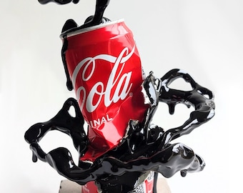 Cola sculpture, street art, "Cola space drips" decor.