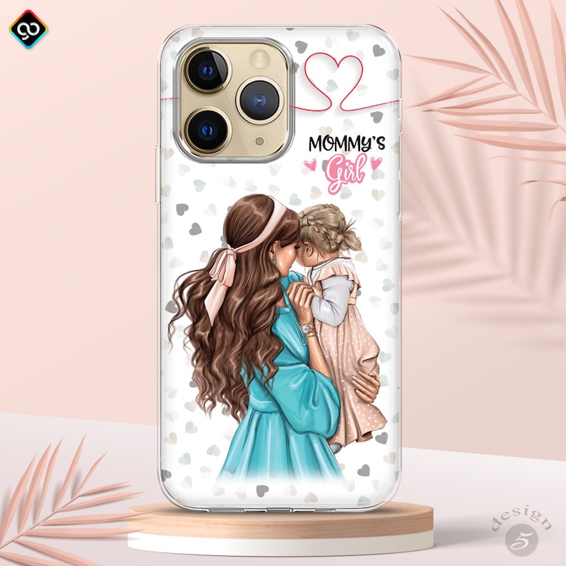 May include: A clear phone case with a white background and a design of a mother and daughter hugging. The design includes pink hearts and the text "Mommy's Girl".