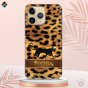 May include: A clear phone case with a leopard print design. The case features a black silhouette of a panther and the name "SOPHIA" in gold lettering on a brown leather-like band.