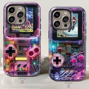 May include: Two clear phone cases with a retro video game design. One case features a football game on the screen, the other a motocross scene. Both cases have a colorful circuit board design with a D-pad and buttons.