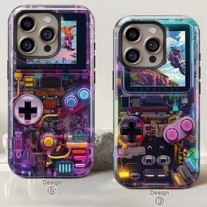 May include: Two clear phone cases with a retro video game theme. Each case features a screen displaying action scenes, a D-pad, and buttons. The cases have a circuit board design with the text "GAMEBOX" and "Design 15" and "Design 16".
