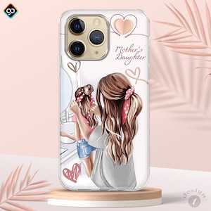 May include: A clear phone case with a white background and a design of two women with long brown hair. The women are wearing casual clothing and have red and white polka dot headbands. The text "Mother's Daughter" is written in pink on the case.