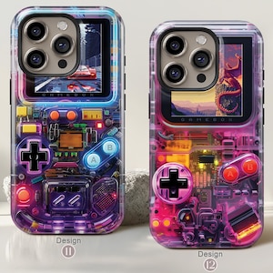 May include: Two clear phone cases with a retro video game design. The cases feature a screen displaying a scene and a game controller layout with buttons and a D-pad. The text "GAMEBOX" is visible on the screen. Design 11 is purple, and Design 12 is pink.